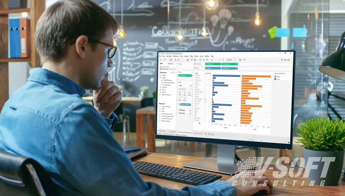 Man working on Tableau data blending tool