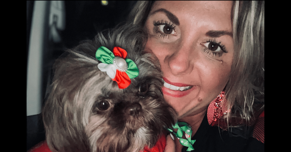 Sarah Schmetzer, Business Development Manager for V-Soft Consulting holding her dog