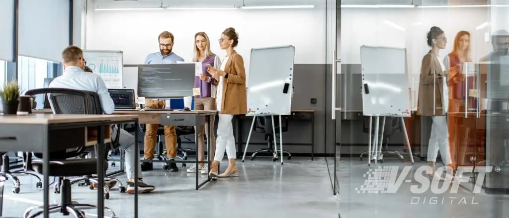 IT employees and Citizen Developers working in an office
