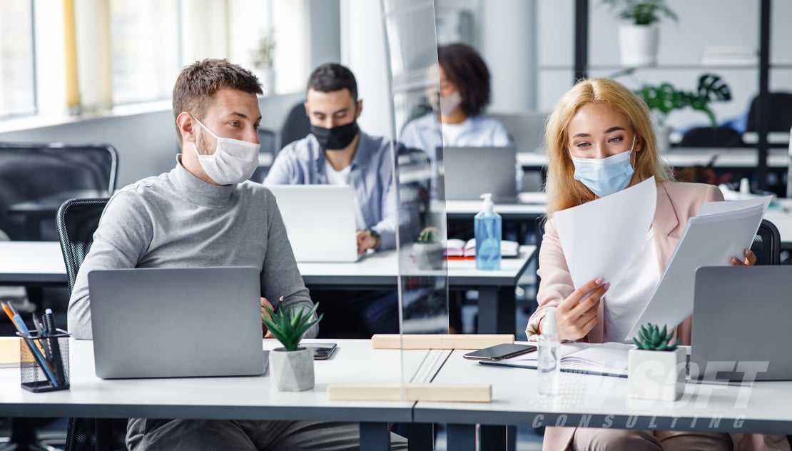 Workers in back in Office wearing masks after COVID-19