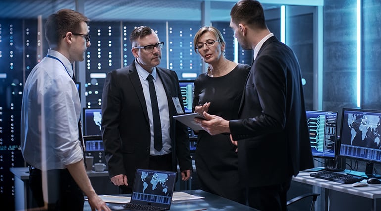 State of the Art Facility Team Managers Working at the Table in Monitoring Room-1