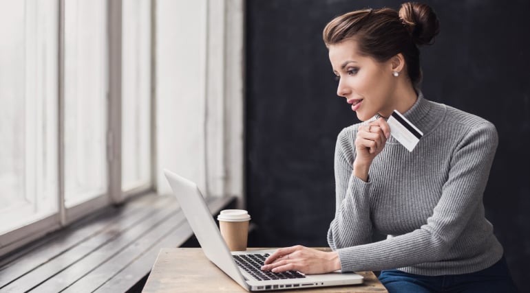 Young woman holding credit card-1