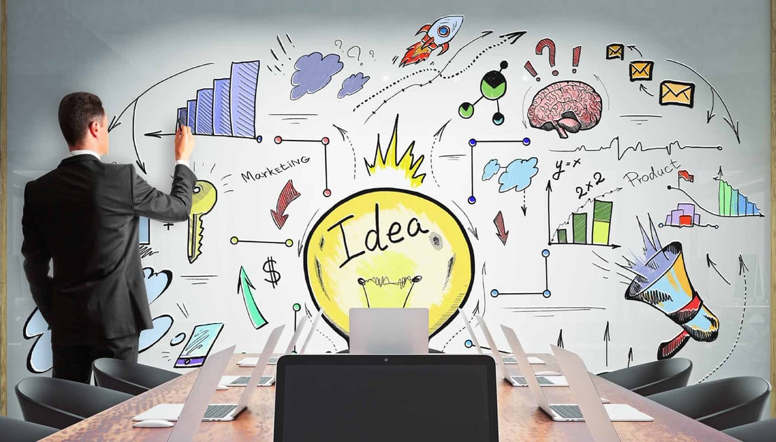 Chief Information Officer brainstorming innovative technology ideas on whiteboard