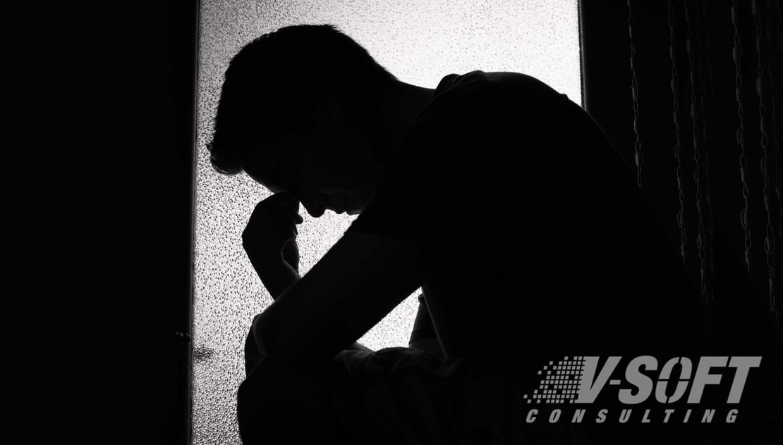 Young Man Feeling Sad with his head bent down